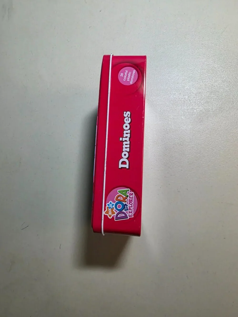 Nick Jr. Dora the Explorer Dominoes Game in Collectible Tin – 28 Plastic Pieces